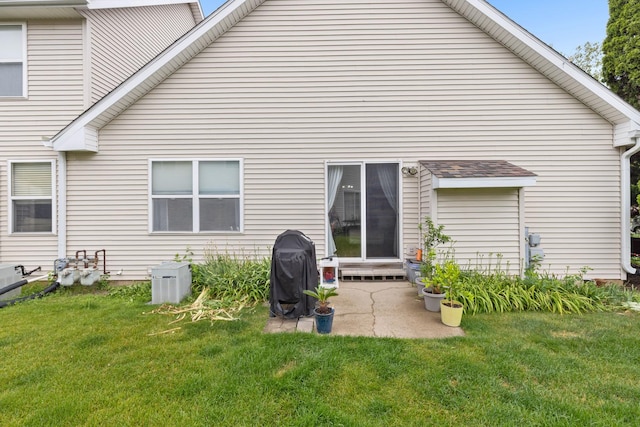 12050 Baneberry Dr Unit 9, Roscoe, IL 61073 - back of house with a yard and a patio