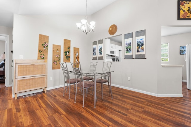 12050 Baneberry Dr Unit 9, Roscoe, IL 61073 - dining room with a chandelier, wood finished floors, and high vaulted ceiling
