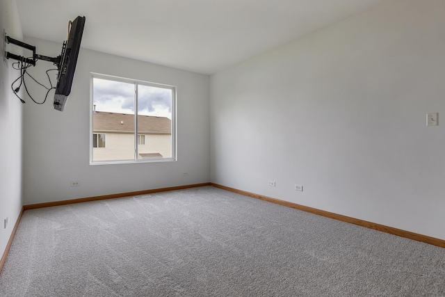 838 Valley Stream Dr, Pingree Grove, IL 60140 - spare room featuring light colored carpet and baseboards