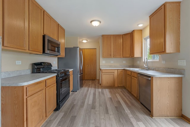 838 Valley Stream Dr, Pingree Grove, IL 60140 - kitchen featuring appliances with stainless steel finishes, light wood-type flooring, and light countertops