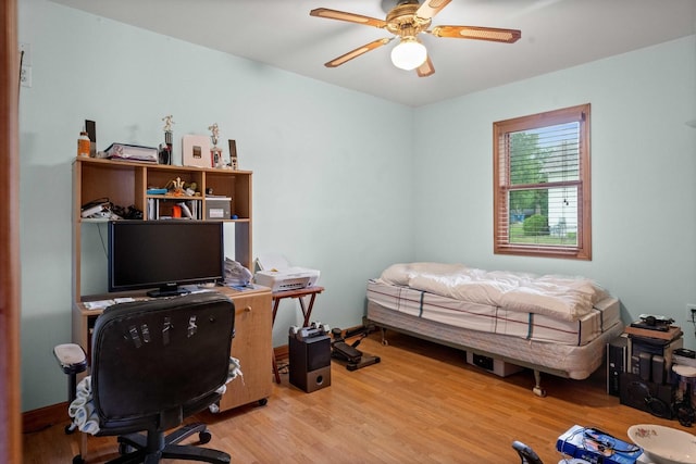 101 W Olive St, Colfax, IL 61728 - home office with wood finished floors and a ceiling fan
