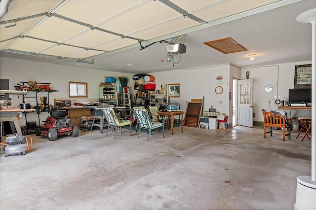 101 W Olive St, Colfax, IL 61728 - garage featuring a workshop area and a garage door opener