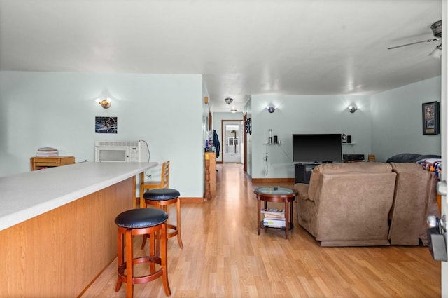 101 W Olive St, Colfax, IL 61728 - living room with light wood finished floors and ceiling fan