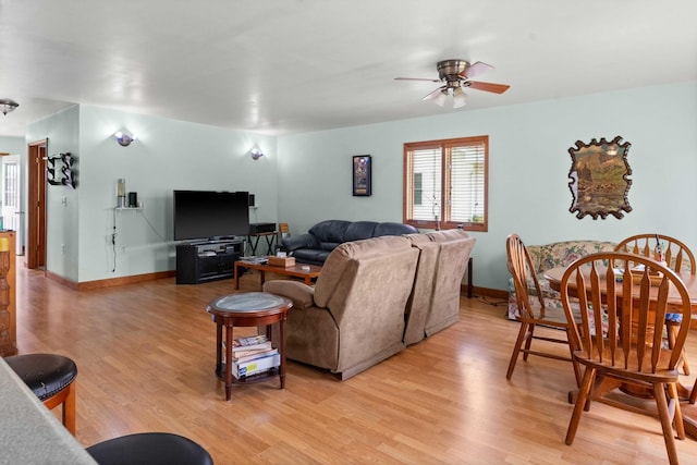 101 W Olive St, Colfax, IL 61728 - living area with ceiling fan and light wood-style floors