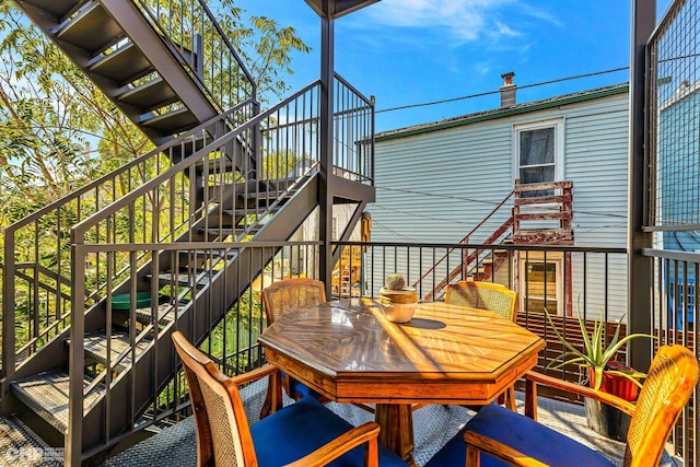 1920 S Shelby Ct, Chicago, IL 60608 - wooden deck featuring stairway and outdoor dining space