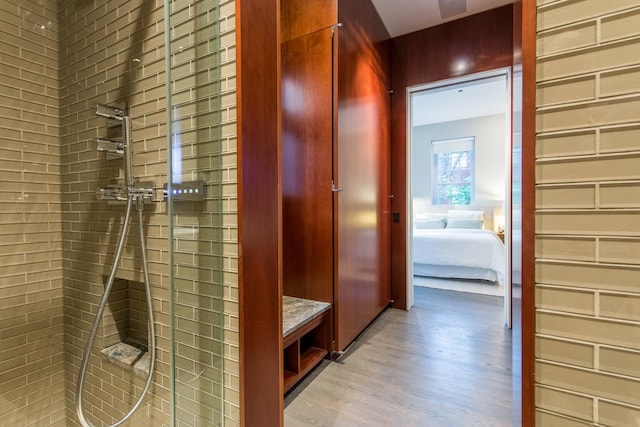1401 N Astor St, Chicago, IL 60610 - bathroom featuring tiled shower, wood finished floors, and ensuite bath