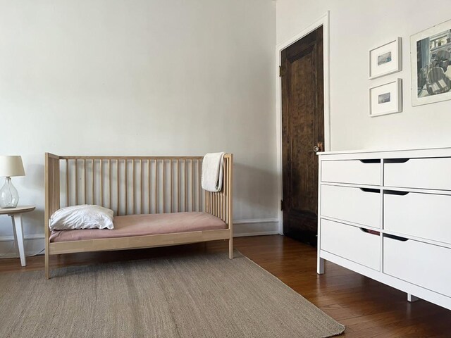 208 N Oak Park Ave Unit 3Jj, Oak Park, IL 60302 - bedroom with wood finished floors and baseboards