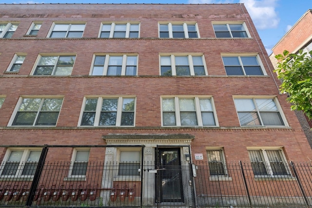 715 E 62nd St Unit 3, Chicago, IL 60637 - view of apartment building / complex featuring a fenced front yard