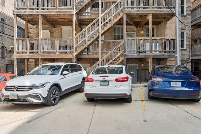 715 E 62nd St Unit 3, Chicago, IL 60637 - view of building exterior featuring stairway and uncovered parking