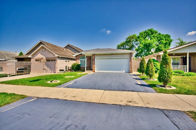 3108 141st St, Blue Island, IL 60406 - ranch-style home with brick siding, asphalt driveway, an attached garage, and a front yard