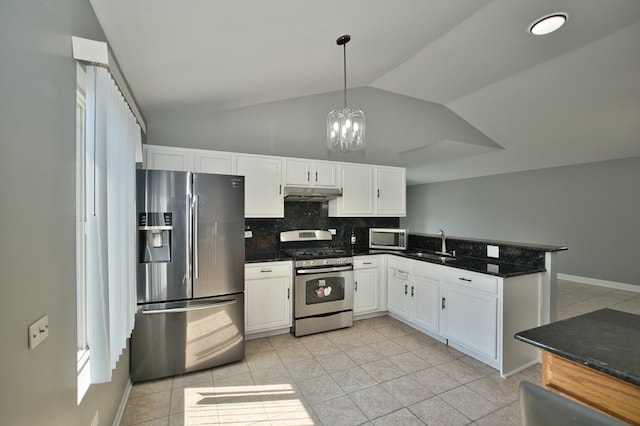 3108 141st St, Blue Island, IL 60406 - kitchen featuring stainless steel appliances, under cabinet range hood, a peninsula, vaulted ceiling, and white cabinets