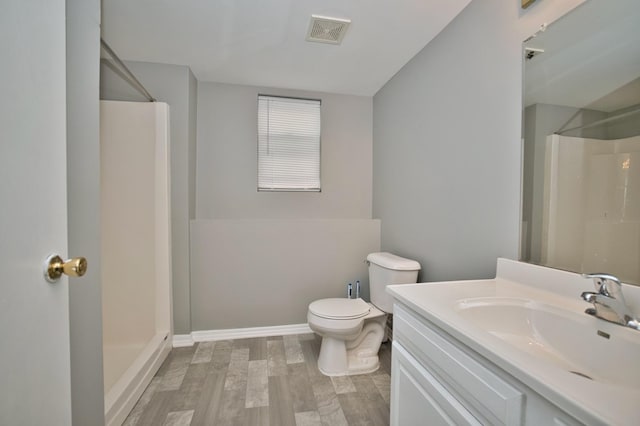 3108 141st St, Blue Island, IL 60406 - bathroom featuring a shower, wood finished floors, and vanity