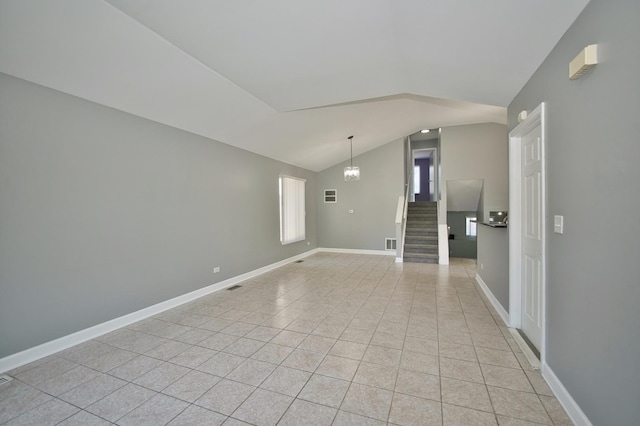 3108 141st St, Blue Island, IL 60406 - unfurnished living room with vaulted ceiling, light tile patterned flooring, stairs, and a chandelier