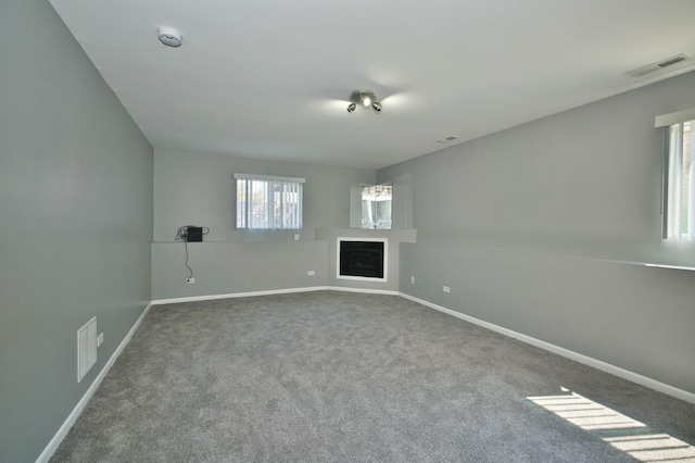 3108 141st St, Blue Island, IL 60406 - unfurnished living room featuring carpet flooring and a fireplace