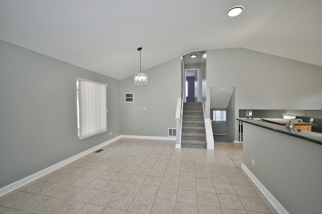 3108 141st St, Blue Island, IL 60406 - unfurnished living room featuring lofted ceiling, light tile patterned floors, a chandelier, and stairway