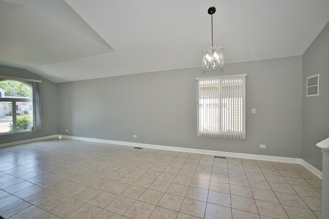 3108 141st St, Blue Island, IL 60406 - empty room with vaulted ceiling, light tile patterned floors, and a chandelier