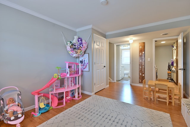 758 N Kenilworth Ave, Elmhurst, IL 60126 - game room with wood finished floors and ornamental molding