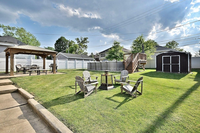 758 N Kenilworth Ave, Elmhurst, IL 60126 - fenced backyard featuring a gazebo, a storage shed, stairs, a fire pit, and a patio