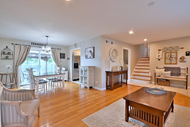 758 N Kenilworth Ave, Elmhurst, IL 60126 - living area with a chandelier, light wood-style floors, stairs, and recessed lighting