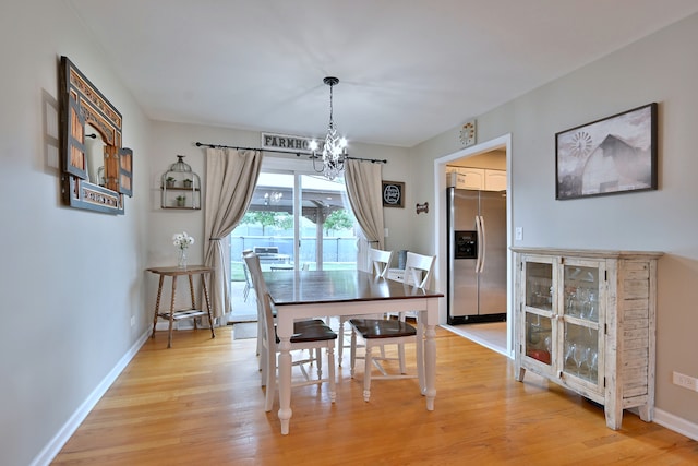 758 N Kenilworth Ave, Elmhurst, IL 60126 - dining area with a chandelier and light wood-type flooring