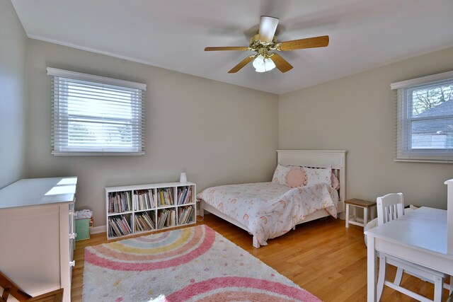 758 N Kenilworth Ave, Elmhurst, IL 60126 - bedroom with multiple windows, light wood-style floors, and a ceiling fan