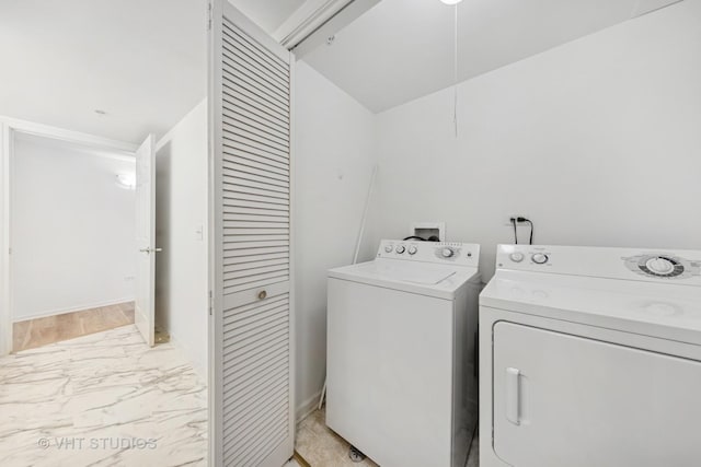 1 N Beacon Pl Unit 502, La Grange, IL 60525 - laundry room with washer and dryer and light marble finish flooring