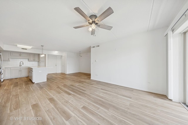 1 N Beacon Pl Unit 502, La Grange, IL 60525 - unfurnished living room featuring light wood finished floors and ceiling fan