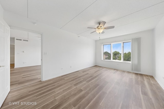 1 N Beacon Pl Unit 502, La Grange, IL 60525 - spare room featuring light wood finished floors and a ceiling fan