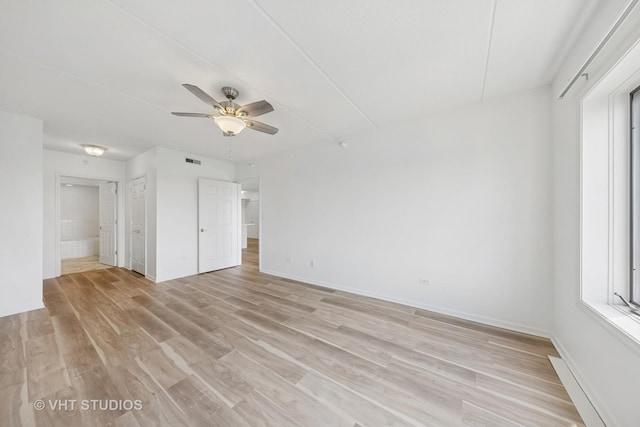 1 N Beacon Pl Unit 502, La Grange, IL 60525 - unfurnished bedroom featuring light wood-style flooring and a ceiling fan