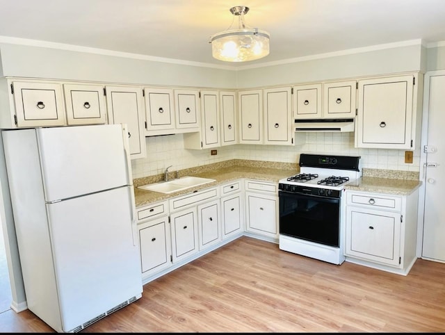 10425 S Hale Ave Unit 3A, Chicago, IL 60643 - kitchen featuring freestanding refrigerator, range with gas cooktop, under cabinet range hood, light countertops, and tasteful backsplash