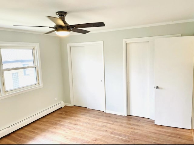 10425 S Hale Ave Unit 3A, Chicago, IL 60643 - unfurnished bedroom with baseboard heating, two closets, ornamental molding, light wood-style floors, and a ceiling fan