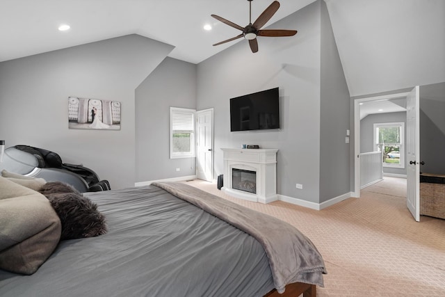 592 E 13th St, Lockport, IL 60441 - bedroom with light carpet, high vaulted ceiling, recessed lighting, a glass covered fireplace, and ceiling fan