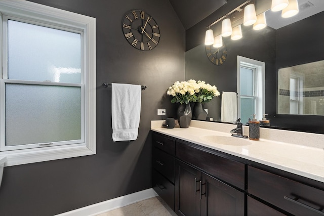 592 E 13th St, Lockport, IL 60441 - full bath with vanity, tile patterned floors, and lofted ceiling