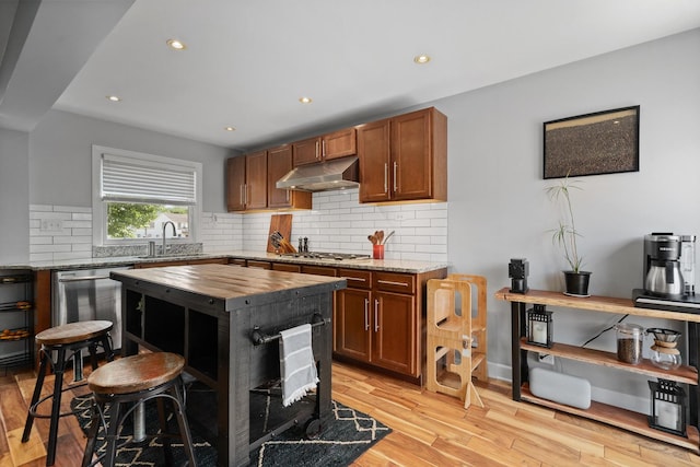 592 E 13th St, Lockport, IL 60441 - kitchen with under cabinet range hood, stainless steel appliances, wood counters, light wood-style flooring, and recessed lighting