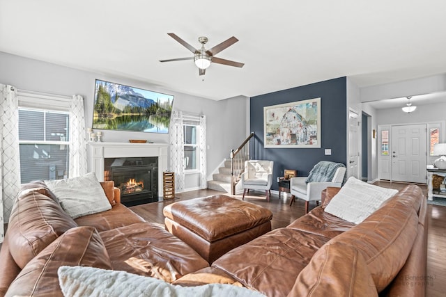 1402 Souders Ave, Elburn, IL 60119 - living room with wood finished floors, a ceiling fan, and a fireplace with flush hearth