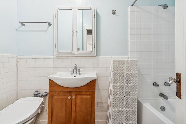 216 N Oak Park Ave Unit 2Aa, Oak Park, IL 60302 - full bath with tile walls, vanity, bathing tub / shower combination, and a wainscoted wall