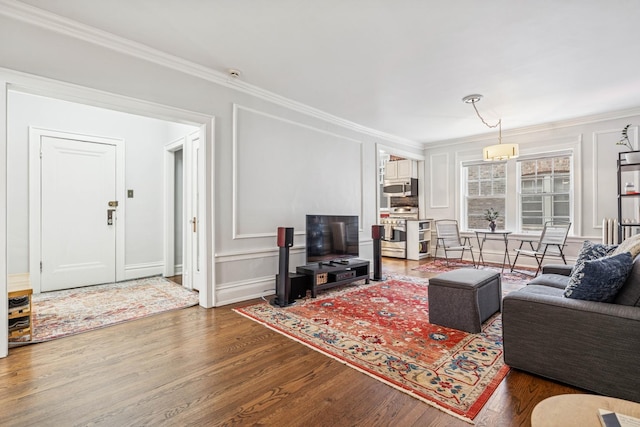 216 N Oak Park Ave Unit 2Aa, Oak Park, IL 60302 - living area with wood finished floors, crown molding, and a decorative wall