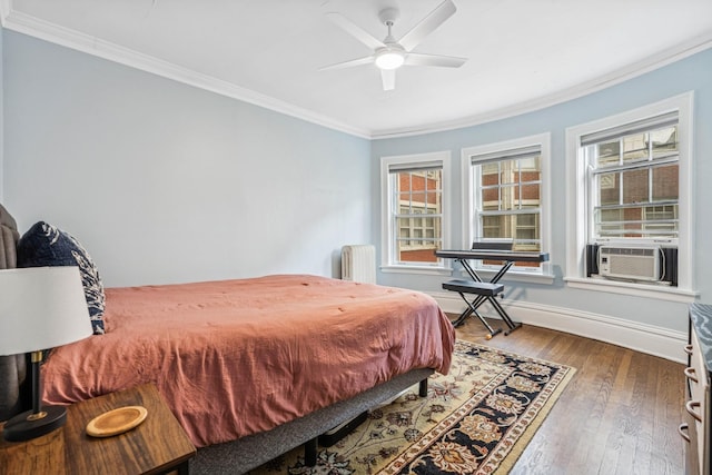 216 N Oak Park Ave Unit 2Aa, Oak Park, IL 60302 - bedroom with crown molding, cooling unit, multiple windows, hardwood / wood-style flooring, and ceiling fan