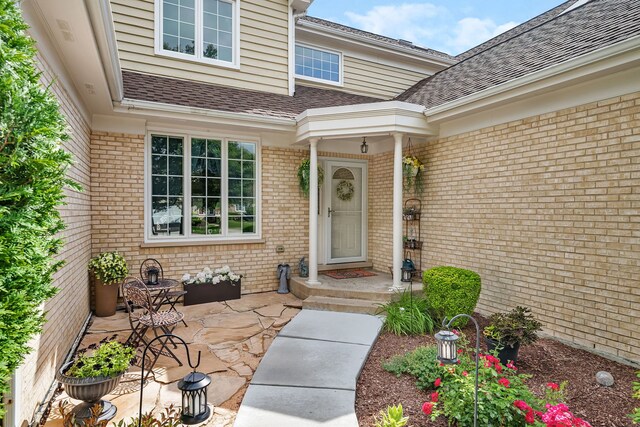 16813 Cardinal Dr, Orland Park, IL 60467 - view of exterior entry featuring brick siding and roof with shingles