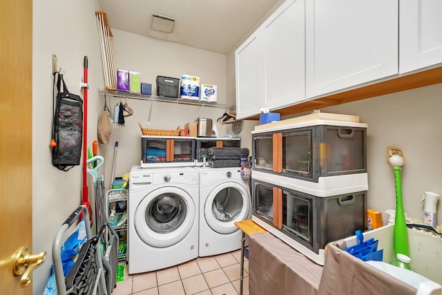 16813 Cardinal Dr, Orland Park, IL 60467 - laundry area with separate washer and dryer, cabinet space, and light tile patterned floors
