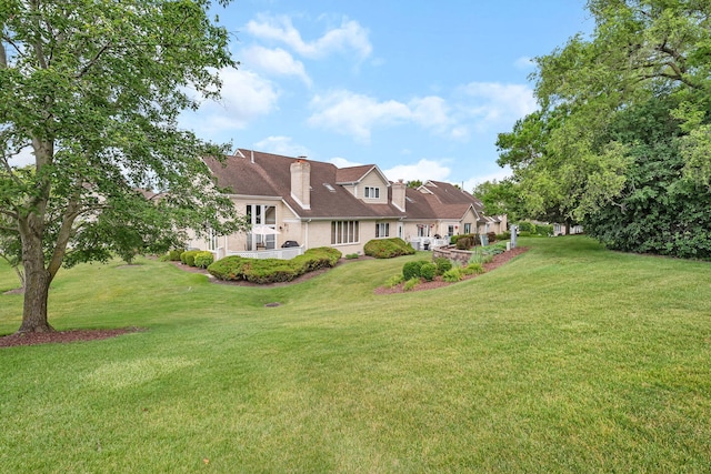 16813 Cardinal Dr, Orland Park, IL 60467 - rear view of house with a lawn and a chimney