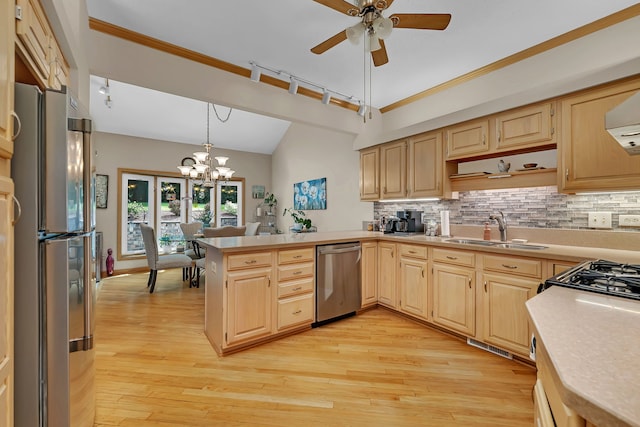 16813 Cardinal Dr, Orland Park, IL 60467 - kitchen featuring appliances with stainless steel finishes, light brown cabinetry, light countertops, vaulted ceiling, and ornamental molding