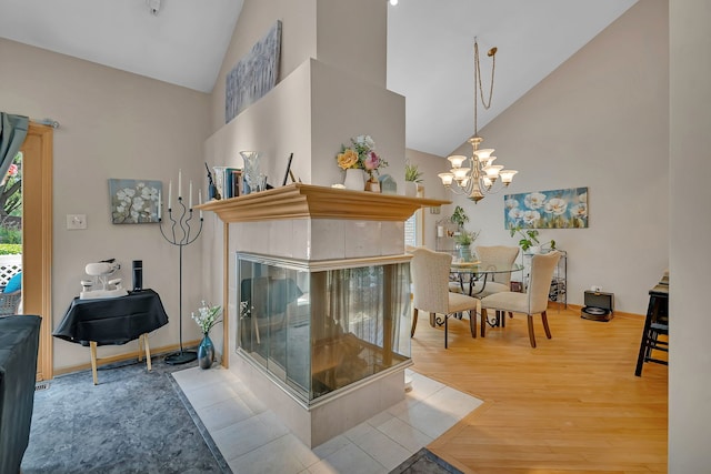 16813 Cardinal Dr, Orland Park, IL 60467 - living area with high vaulted ceiling, wood finished floors, plenty of natural light, and a chandelier