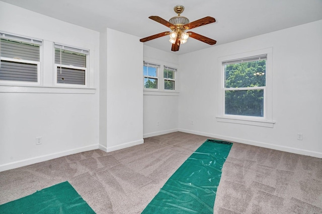 1057 W Park Front St, Joliet, IL 60436 - carpeted empty room with a ceiling fan and baseboards