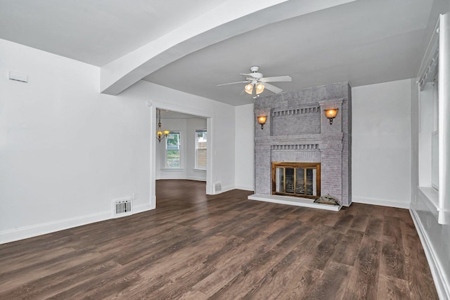 1057 W Park Front St, Joliet, IL 60436 - unfurnished living room with ceiling fan, a fireplace, wood finished floors, and beam ceiling