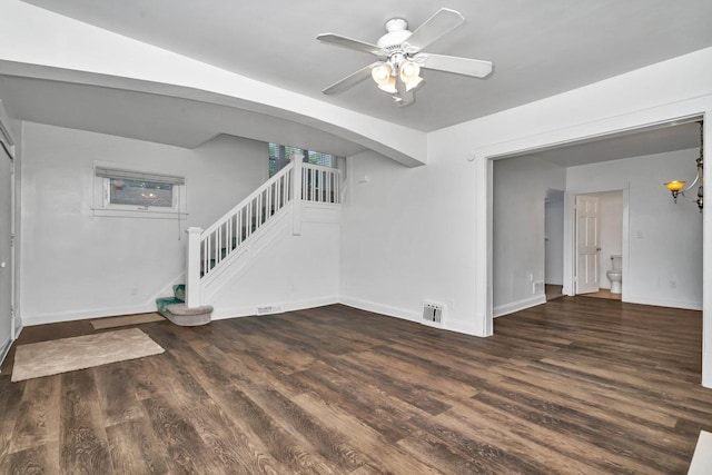 1057 W Park Front St, Joliet, IL 60436 - unfurnished living room with stairs, wood finished floors, and a ceiling fan