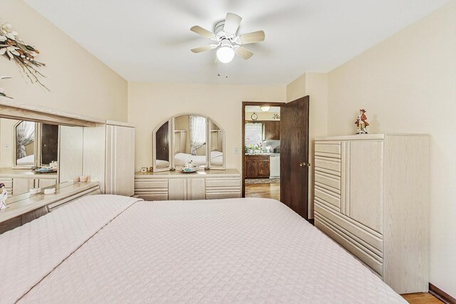 11531 S S Ave J, Chicago, IL 60617 - bedroom with wood finished floors and a ceiling fan