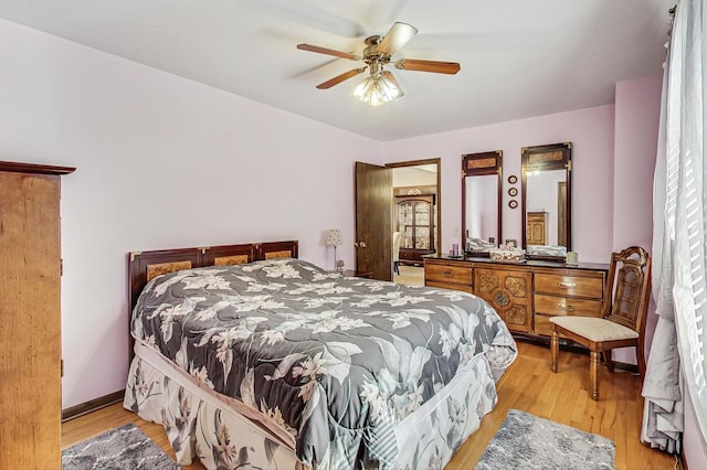11531 S S Ave J, Chicago, IL 60617 - bedroom with light wood finished floors and a ceiling fan