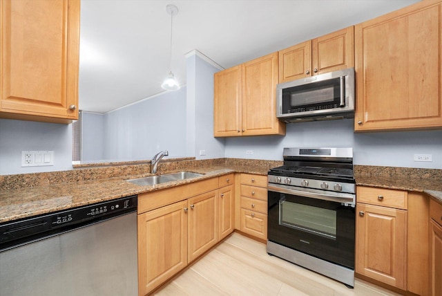 420 E Waterside Dr Unit 407, Chicago, IL 60601 - kitchen with appliances with stainless steel finishes, light brown cabinets, dark stone counters, light wood-type flooring, and ornamental molding