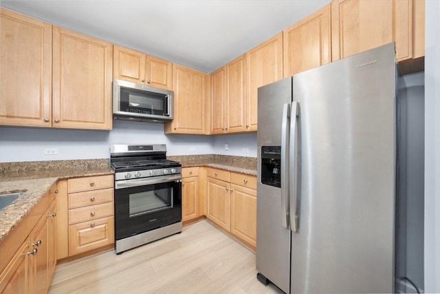 420 E Waterside Dr Unit 407, Chicago, IL 60601 - kitchen with stainless steel appliances, light brown cabinets, and light stone countertops